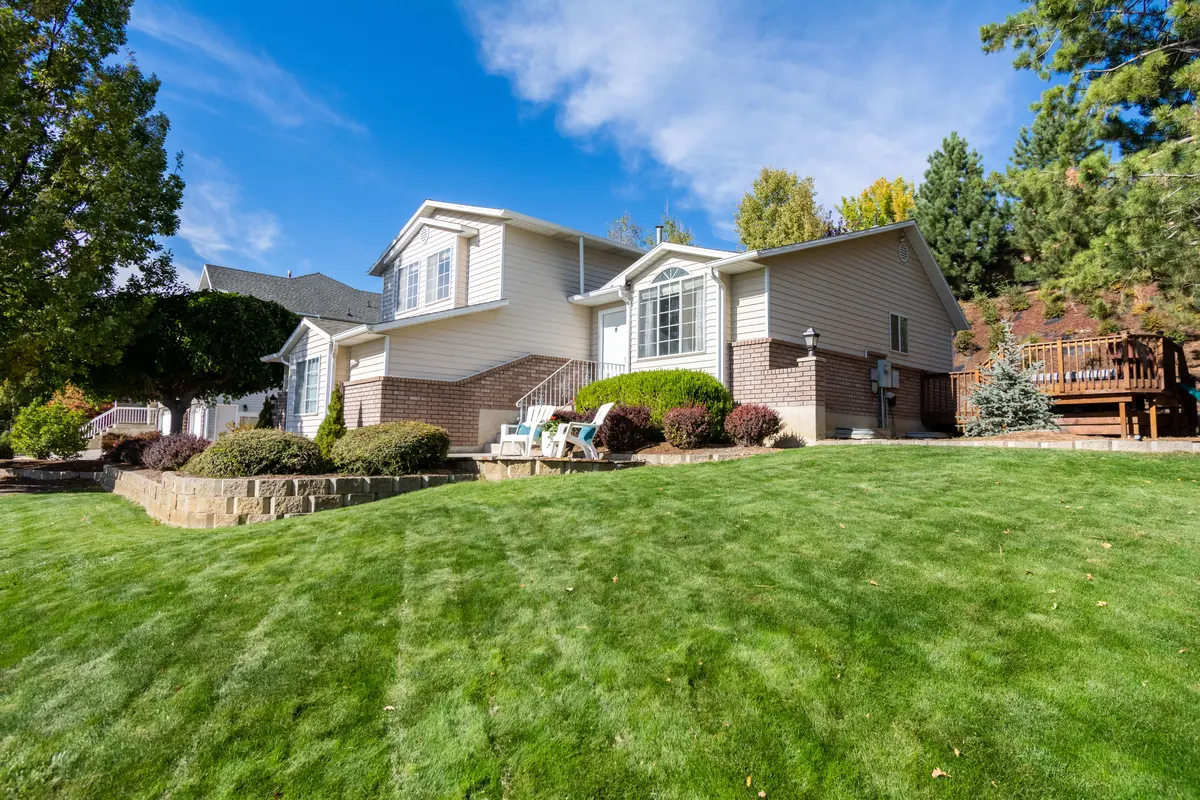A well-kept residential lawn framing a suburban home